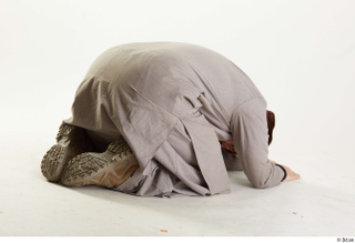 Luis Donovan Afgan Civil Praying kneeling praying whole body 0006.jpg